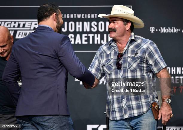 And Pride legends Antonio Rodrigo Nogueira and Don Frye shake hands on stage during the UFC International Fight Week Legends Panel at the Park...