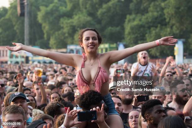 Festial goers enjoy Kings Of Leon perform on stage at the Barclaycard Presents British Summer Time Festival in Hyde Park on July 6, 2017 in London,...