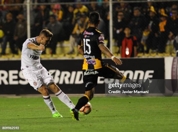 Nicolas Pasquini of Lanus takes a shot and scores the opening goal during a match between The Strongest and Lanus as part of Copa CONMEBOL...