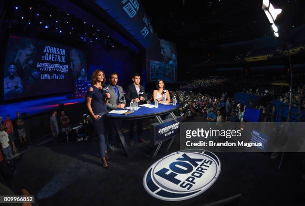 Karyn Bryant, Kenny Florian, Dominick Cruz, and Megan Olivi pose host the UFC weigh-in at the Park Theater on July 6, 2017 in Las Vegas, Nevada.