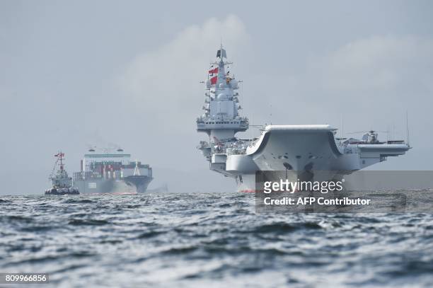 China's sole aircraft carrier, the Liaoning , arrives in Hong Kong waters on July 7 less than a week after a high-profile visit by president Xi...