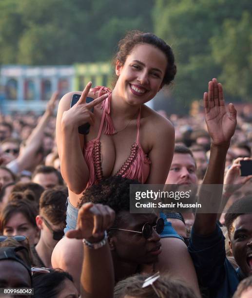 Festival goers enjoy Kings Of Leon perform on stage at the Barclaycard Presents British Summer Time Festival in Hyde Park on July 6, 2017 in London,...