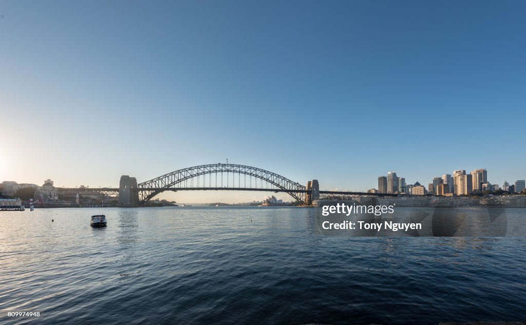 Beautiful sunrise over Sydney Harbour Bridge. Viewed from Blues Point Reserve in North Sydney.