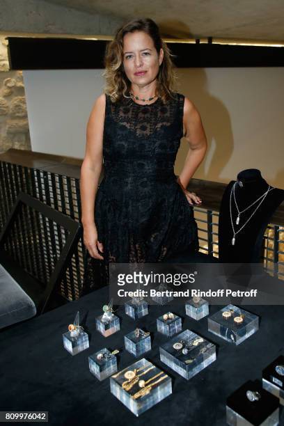 Jade Jagger poses with jewels of her creation during the "Don't Take it Personally" by Jade Jagger & Jean-Baptiste Pauchard Exhibition Party on July...
