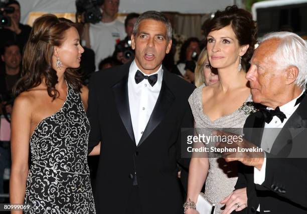 Model Sarah Larson, actor George Clooney, actress Julia Roberts, and designer Giorgio Armani arrive at the Metropolitan Museum of Art Costume...