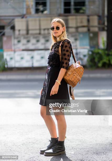 Alessa Winter wearing MCM backpack sheer blouse, black skirt during the Mercedes-Benz Fashion Week Berlin Spring/Summer 2018 at Kaufhaus Jandorf on...