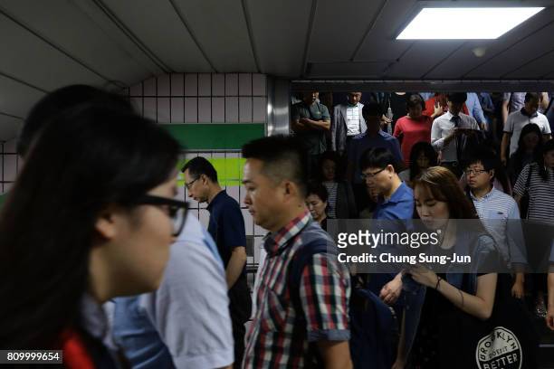 Commuters walk through the Metro on July 7, 2017 in Seoul, South Korea. The U.S. Said that it will use military force if needed to stop North Korea's...