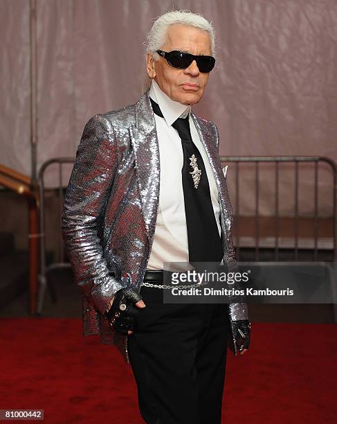 Designer Karl Lagerfeld departs the Metropolitan Museum of Art Costume Institute Gala, Superheroes: Fashion and Fantasy, held at the Metropolitan...