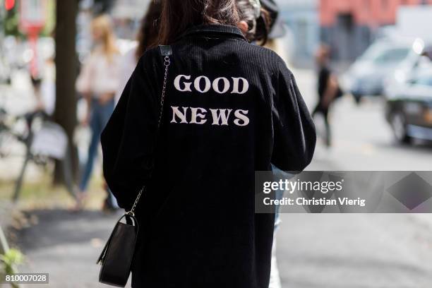 Guest wearing a jacket with the print Good News during the Mercedes-Benz Fashion Week Berlin Spring/Summer 2018 at Kaufhaus Jandorf on July 6, 2017...