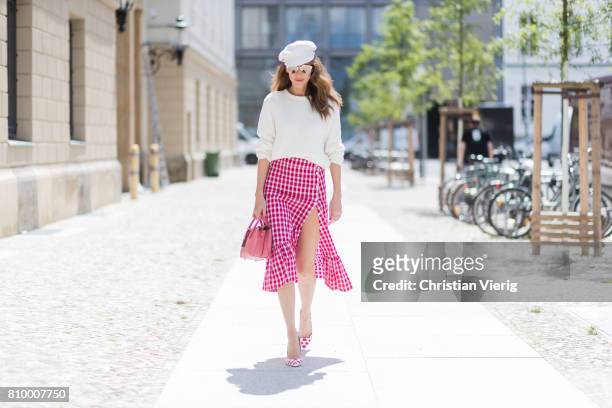 Alexandra Lapp wearing the Milla Tote bag from MCM which is crafted in Spanish leather, white knitwear from Oui Fashion, Chanel cap in white, Dior...