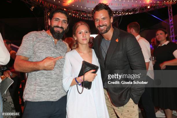 Numan Acar and Emely Luca, and her father Stephan Luca during the 50th anniversary celebration of Marc O'Polo at its headquarters on July 6, 2017 in...