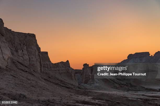 orange sky at dusk in the star valley, qeshm island, persian gulf, hormozgan province, southern iran - persian gulf stock pictures, royalty-free photos & images