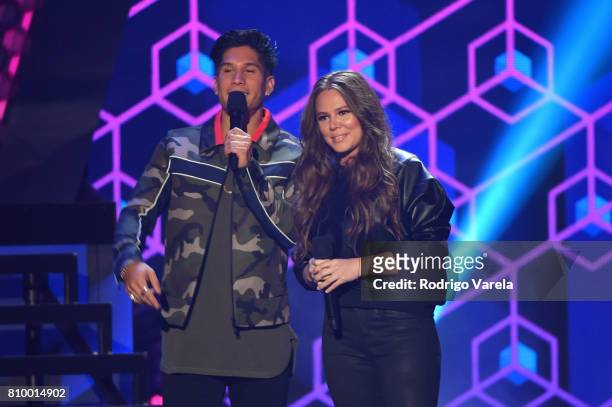 Chino Miranda and Joy Uecke present an award during Univision's "Premios Juventud" 2017 Celebrates The Hottest Musical Artists And Young Latinos...