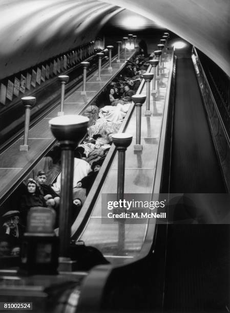 Londoners shelter from air raids in an underground station during World War II, 1940.