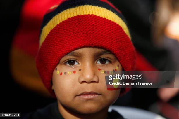 Young boy takes part in the 2017 NAIDOC March on July 7, 2017 in Melbourne, Australia. The march was organised to call for a day of mourning and to...
