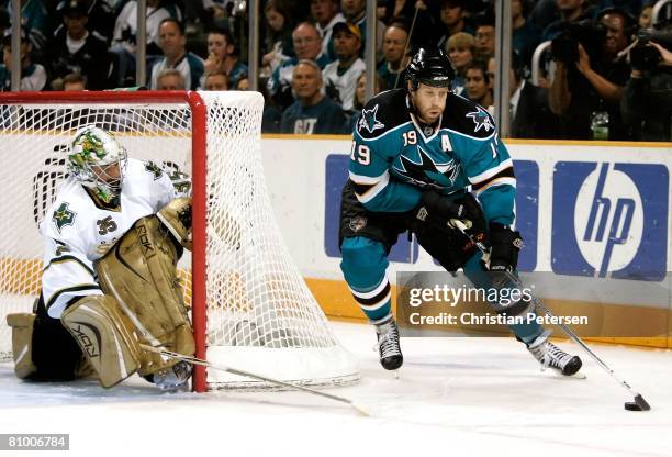 Joe Thornton of the San Jose Sharks attempts a wrap around shot on goaltender Marty Turco of the Dallas Stars during game two of the Western...