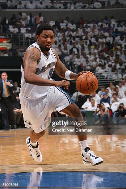 Roger Mason of the Washington Wizards moves the ball against the Cleveland Cavaliers in Game Six of the Eastern Conference Quarterfinals during the...