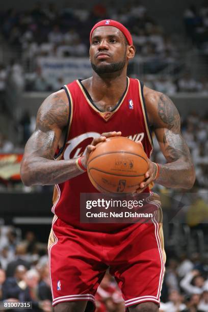LeBron James of the Cleveland Cavaliers shoots a free throw in Game Six of the Eastern Conference Quarterfinals against the Washington Wizards during...