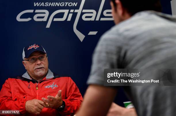 Washington Capitals head coach Barry Trotz meets with defensive prospect Connor Hobbs at the end of the Washington Capitals Development Camp at...
