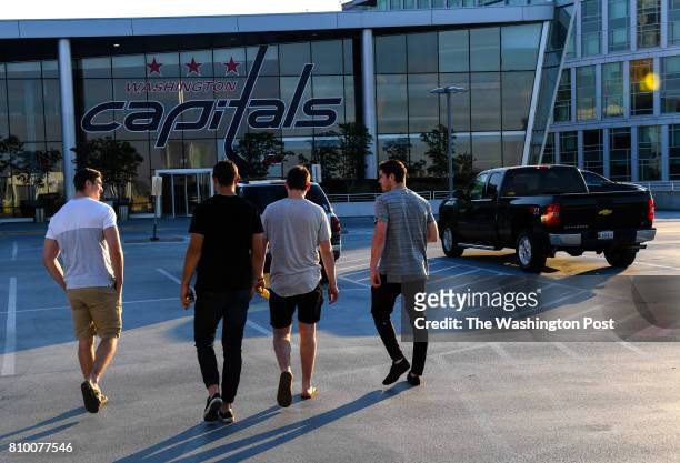 Washington Capitals defensive prospect Connor Hobbs, right, walks with other players to the Capitals facility for the day during the Washington...