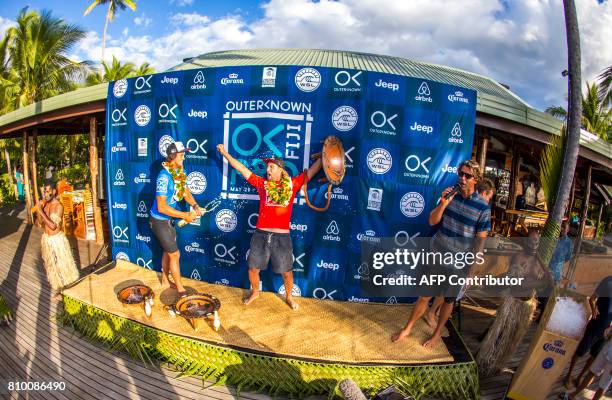 This photo taken on June 15, 2017 shows winner Matt Wilkinson of Australia celebrating his victory in the OuterKnown Fiji Pro surfing competition at...