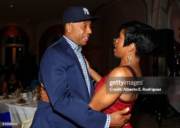 Entrepreneur Russell Simmons and actress Regina King attend the USA TODAY Hollywood Hero honoring Magic Johnson at the Beverly Hills Hotel on May 6,...