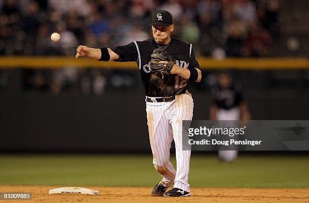 Shortstop Clint Barmes of the Colorado Rockies fields a ball against the St. Louis Cardinals at Coors Field on May 6, 2008 in Denver, Colorado. The...