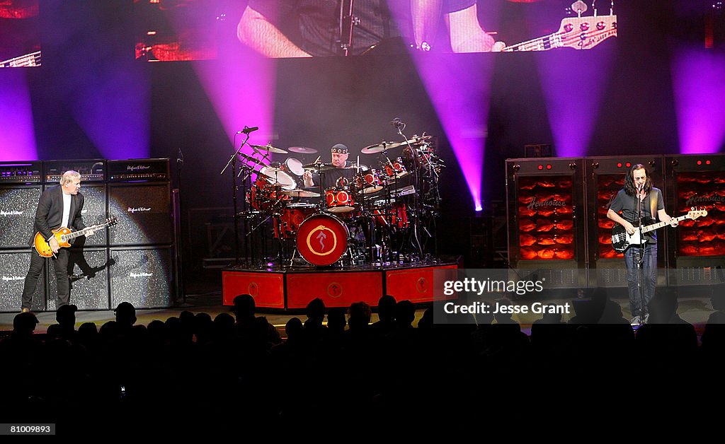 Musicians Alex Lifeson Neil Peart And Geddy Lee Of The Band Rush musicians-alex-lifeson-neil-peart-and-geddy-lee-of-the-band-rush