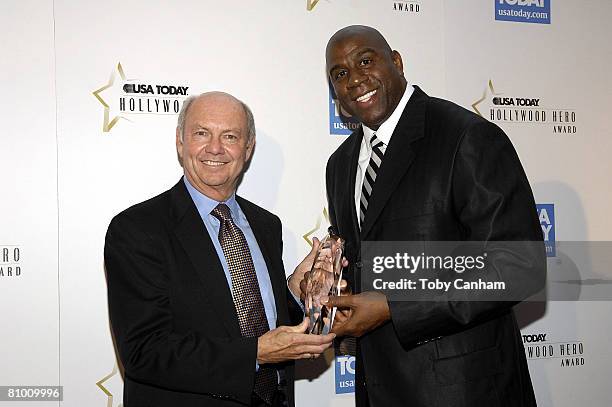 Former NBA legend Earvin "Magic" Johnson poses with the 3rd annual USA Today Hollywood Hero Award, presented by USA Today President Craig A. Moon in...