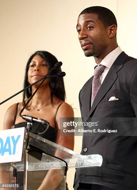 Magic Johnson's son Andre Johnson speaks as Cookie Johnson looks on during the USA TODAY Hollywood Hero honoring Magic Johnson at the Beverly Hills...