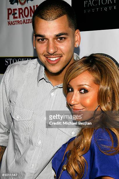 Robert Kardashian and recording artist Adrienne Bailon of the Cheetah Girls arrive at the Fashion Factory Boutique Grand Opening Celebration on May...