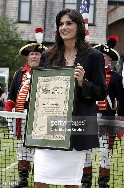International Tennis Hall of Fame inductee Gabriela Sabatini poses on a grass court at the Hall of Fame in Newport, R.I. On Saturday July 15, 2006.
