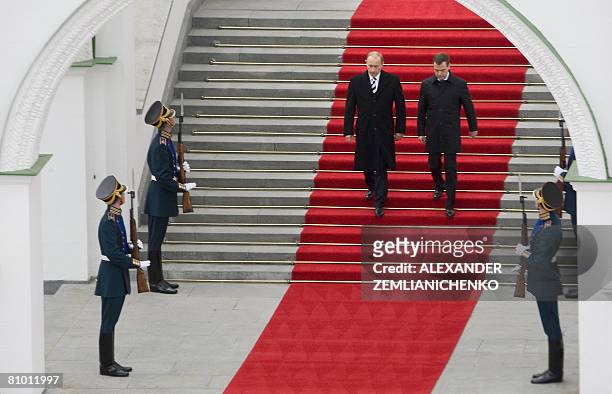 Outgoing Russian President Vladimir Putin and new Russian President Dmitry Medvedev walk down steps during an inauguration ceremony for Medvedev in...