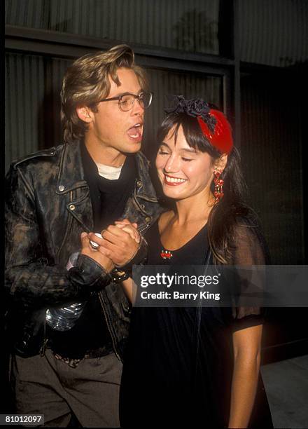 File Photo of Brad Pitt & Jill Schoelen in Los Angeles, California at a screening and party for the film "Red Heat"