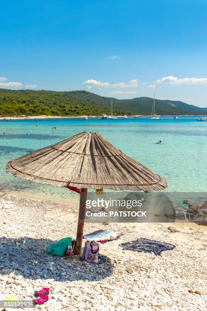 straw umbrella at sakarun beach - sakarun bildbanksfoton och bilder