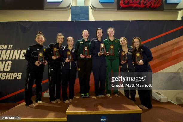 The 3 meter diving competitors receive their trophies during the Division II Men's and Women's Swimming & Diving Championship is held at the...