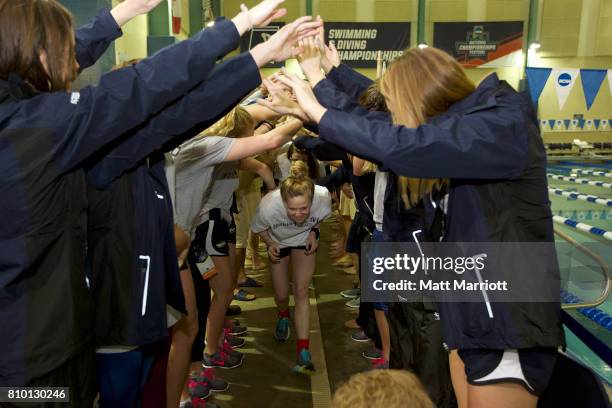 The Drury University team receives their second place trophy during the Division II Men's and Women's Swimming & Diving Championship held at the...