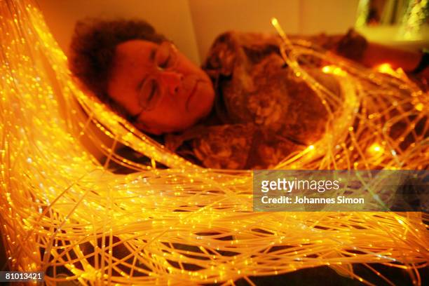 Anna Wirschnitzke, inhabitant of the St.Michael Zentrum, residential home for the elderly, relaxes in a light and sound room after a physical fitness...