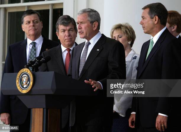 President George W. Bush makes a statement after meeting with members of the House Republican Conference as House Minority Leader Rep. John Boehner ,...