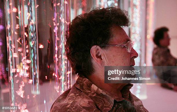 Anna Wirschnitzke, inhabitant of the St.Michael Zentrum, residential home for the elderly, relaxes in a light and sound room after a physical fitness...