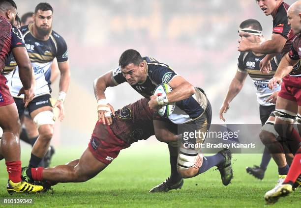 Rory Arnold of the Brumbies takes on the defence during the round 16 Super Rugby match between the Reds and the Brumbies at Suncorp Stadium on July...