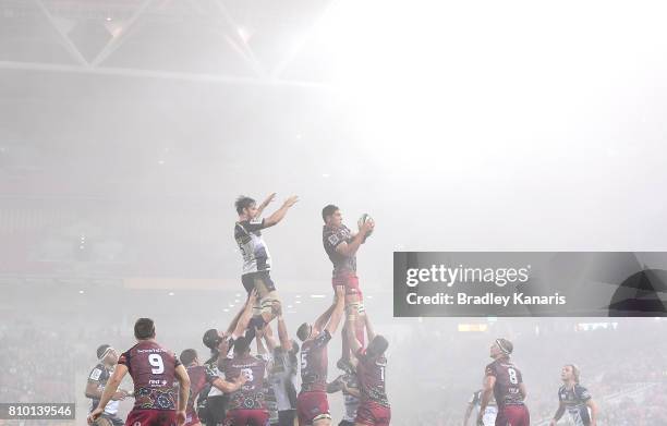 Rob Simmons of the Reds competes at the lineout as a blanket of fog can be seen during the round 16 Super Rugby match between the Reds and the...