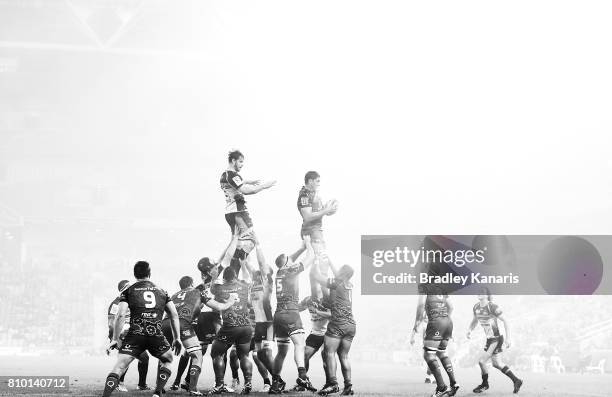 Rob Simmons of the Reds competes at the lineout as a blanket of fog can be seen during the round 16 Super Rugby match between the Reds and the...