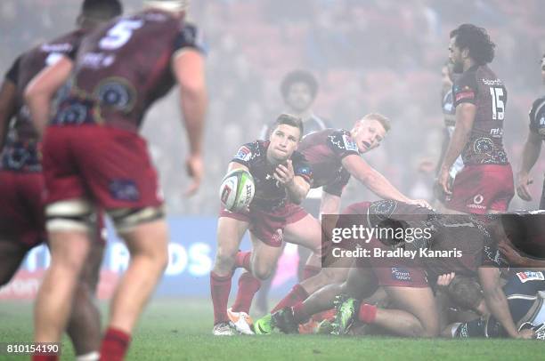 James Tuttle of the Reds passes the ball during the round 16 Super Rugby match between the Reds and the Brumbies at Suncorp Stadium on July 7, 2017...