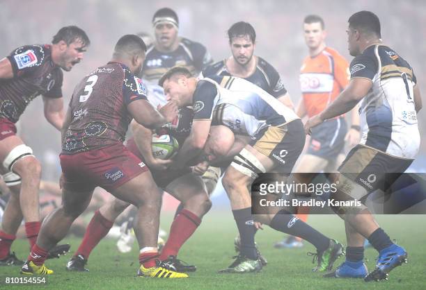 Stephen Moore of the Reds takes on the defence during the round 16 Super Rugby match between the Reds and the Brumbies at Suncorp Stadium on July 7,...
