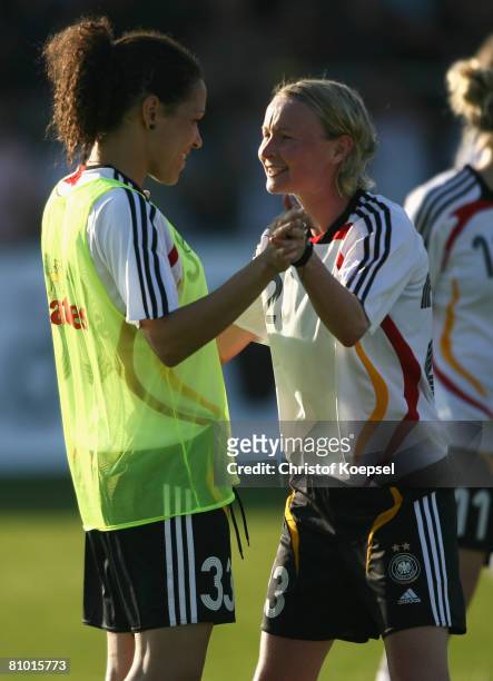 Conny Pohlers and Celia Okoyino da Mdabi of Germany celebrate the 5-0 victory and the qualification for the Euro after the Womens Euro 2009 qualifier...