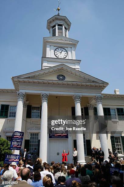 Democratic presidential hopeful U.S. Senator Hillary Clinton speaks as her daughter Chelsea Clinton stands near her during a campaign event at...