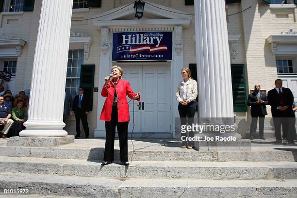 Democratic presidential hopeful U.S. Senator Hillary Clinton speaks as her daughter Chelsea Clinton stands near her during a campaign event at...