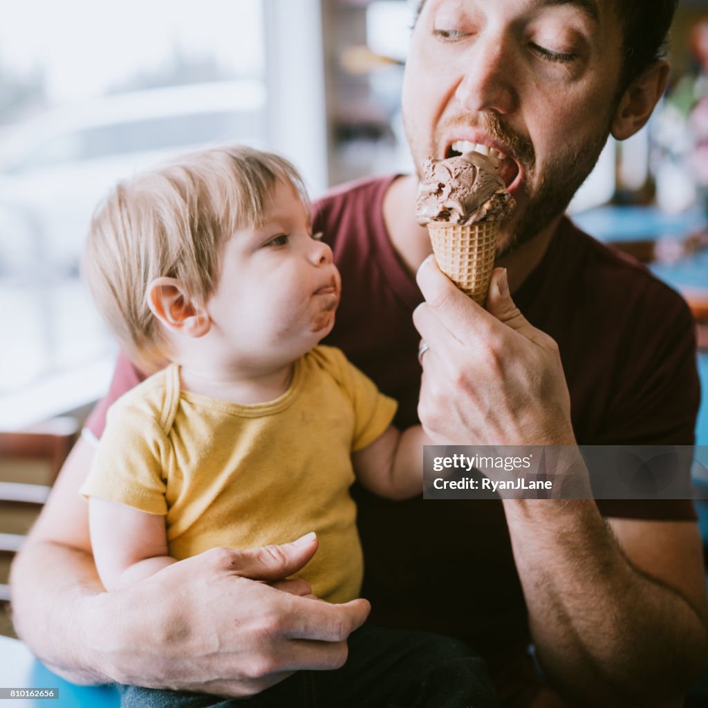 Father Feeding Baby Ice Cream Cone