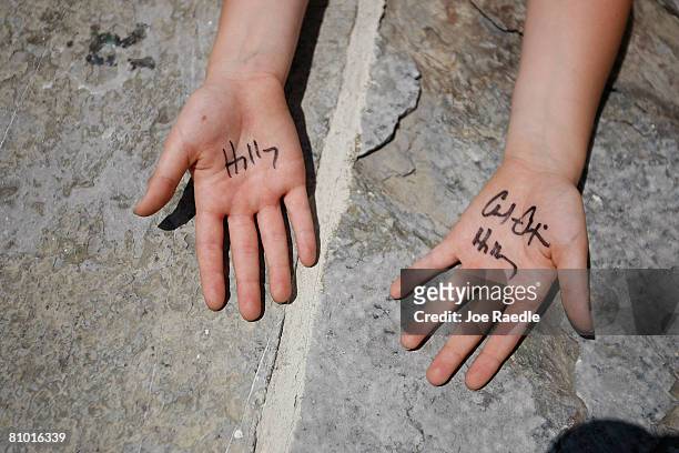 Child wears the autograph of Democratic presidential hopeful U.S. Senator Hillary Clinton on her hands during a campaign event at Shepherd University...